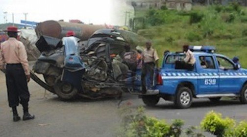 Ogun car crash Enugu bus FRSC officials at an accident site