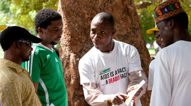 FILE PHOTO: A healthcare giver sensitizing people on HIV/AIDS