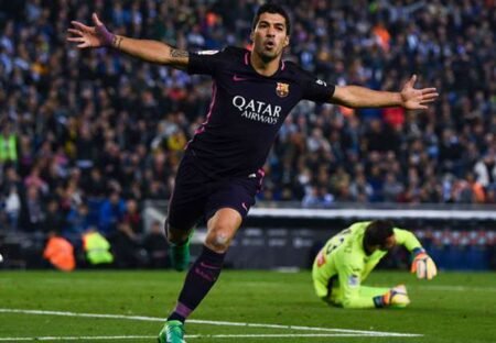 Luis Suarez celebrates his first goal against Espanyol