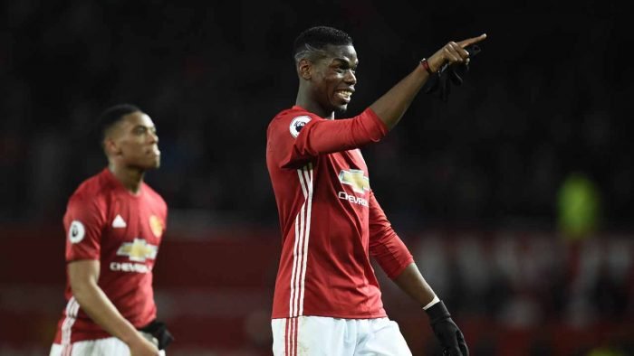 Man Utd French dou Anthony Martial (L) walks with Paul Pogba