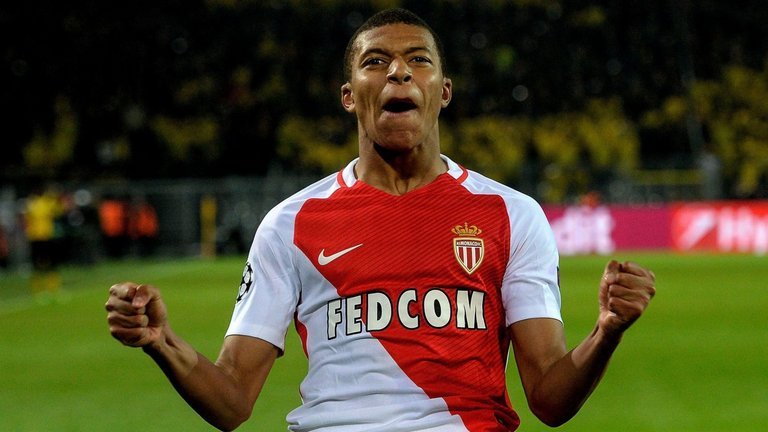 Monaco's Kylian Mbappe celebrates scoring at Signal Iduna Park