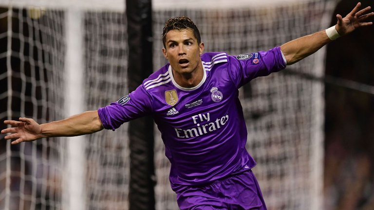 Cristiano Ronaldo celebrates his second goal as Real win Champions League