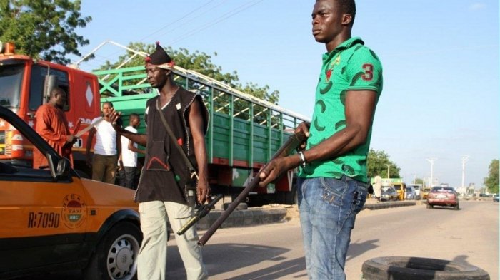 FILE: Civilian JTF members mount a roadblock in Maiduguri, Borno State