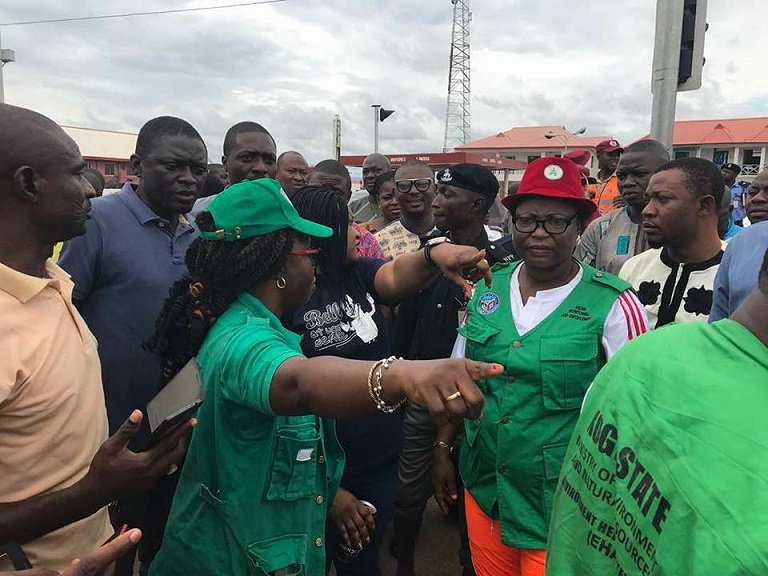 FILE PHOTO: Mrs. Rosemary Osikoya Commissioner of Environment and Natural Resources in Kogi State getting on-site report of the flash floods SEMA