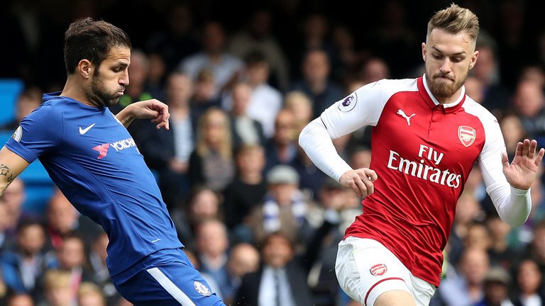 Cesc Fabresgas of chelsea battles for the ball