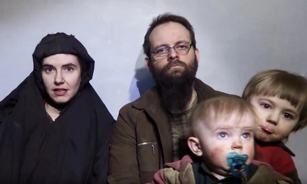 Still image taken 19 Dec. 2016 shows American Caitlan Coleman, left, speaking next to her Canadian husband Joshua Boyle and their two sons