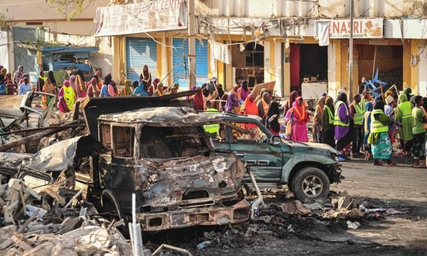 Destroyed vehicles in the centre of Mogadishu. Officials fear the death toll will continue to rise.