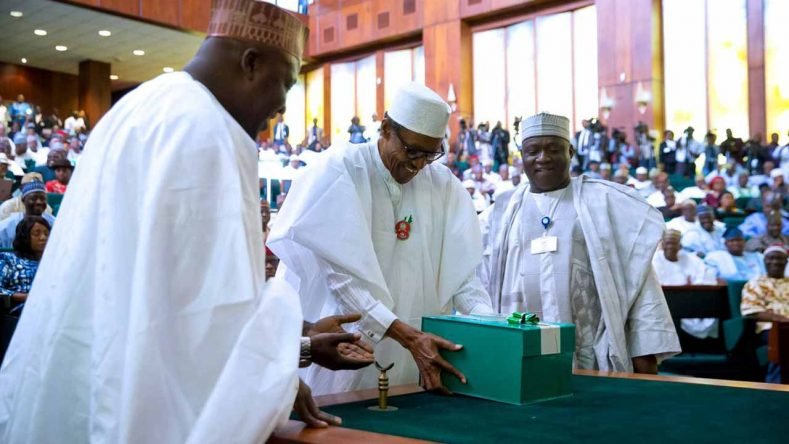 FILE: President Muhammadu Buhari (C) presenting copies of the 2017 budget documents to the National Assembly December 14, 2016. Supplementary Budget