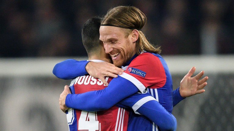 Basel defender Michael Lang celebrates scoring against Manchester United