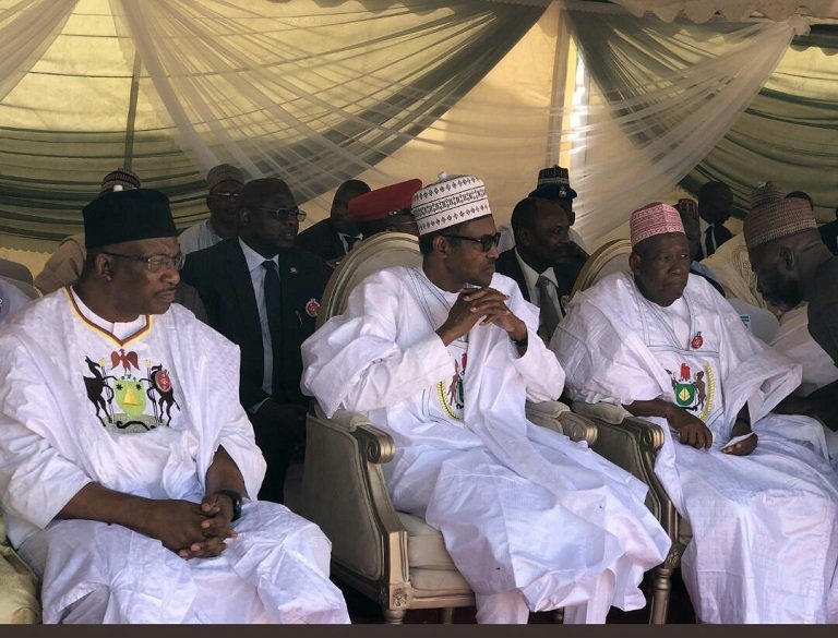 FILE: Interior Minister, Gen Dambazau (rtd) and Governor Abdullahi Ganduje flank President Muhammadu Buhari