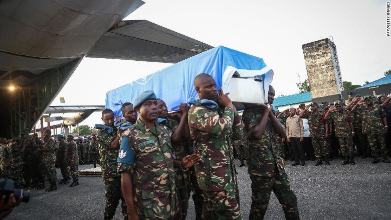 Tanzanian soldiers carry the coffin of a UN peacekeeper in the Tanzanian capital of Dar es Salaam on December 11.