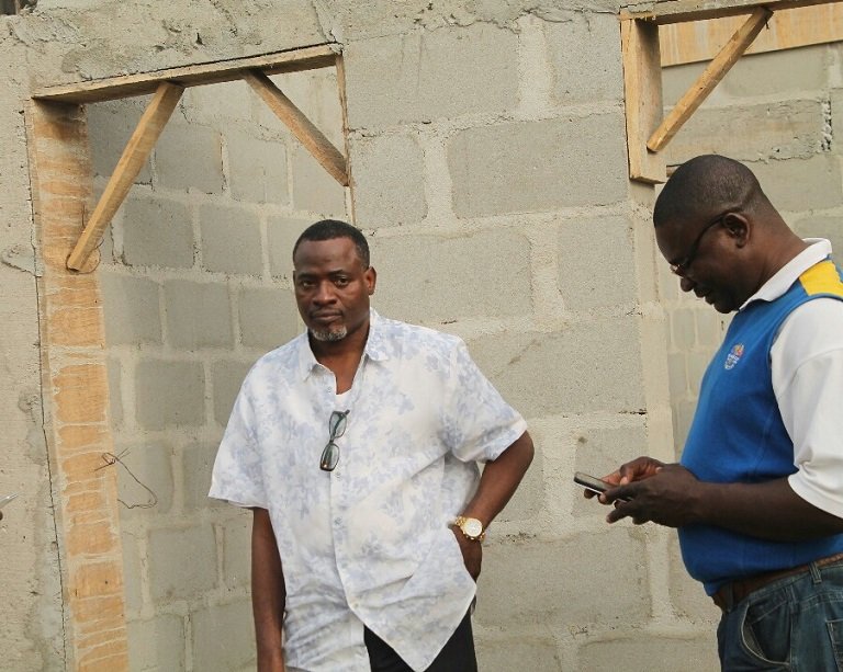 Chairman of Surulere Local Government, Tajudeen Ajide, (L) inspecting the construction of a new Customary Court