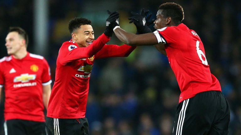 Jesse Lingard celebrates with Paul Pogba after scoring United's second