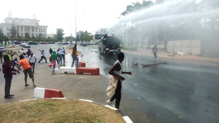 FILE PHOTO: Shiite protesters pelting stones at a Nigerian Police armoured tank