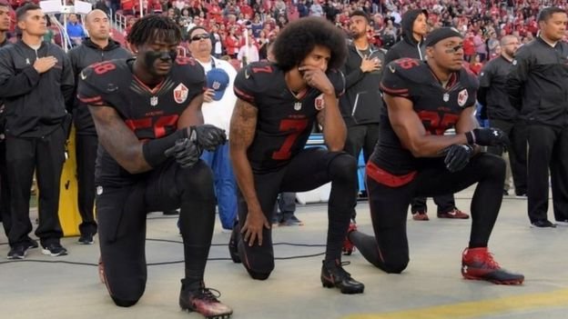 San Francisco 49ers quarterback Colin Kaepernick (c) began the protest in 2016