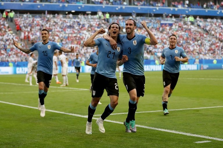 Edison Cavani scored for Uruguay as they won all three group matches, the first team to do so without conceding a goal since Argentina in 1998