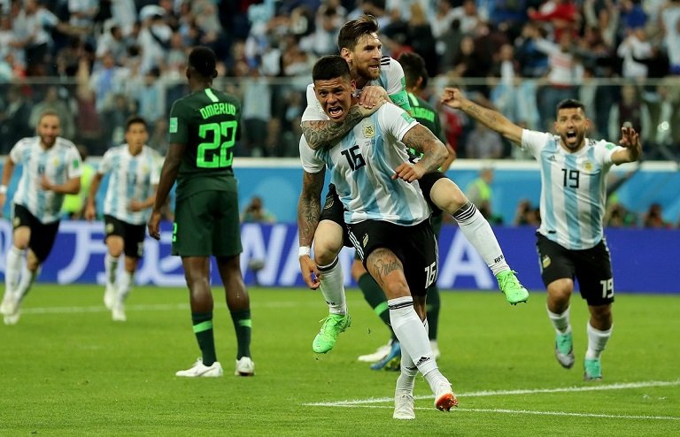 Lionel Messi celebrates with Marcos Rojo as they celebrate Argentina's winning goal