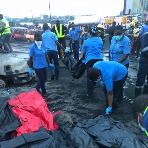 Burnt bodies covered in bags after the Otedola Bridge fire accident