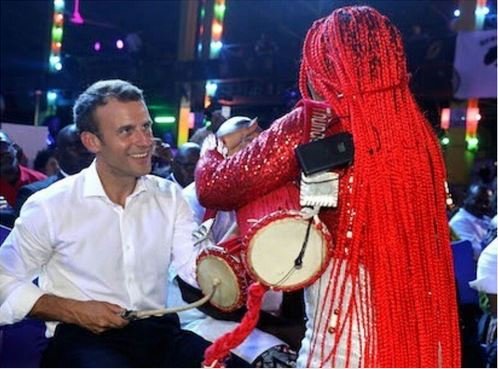 French President Emmanuel Macron drumming at the Afrika Shrine in Ikeja, Nigeria