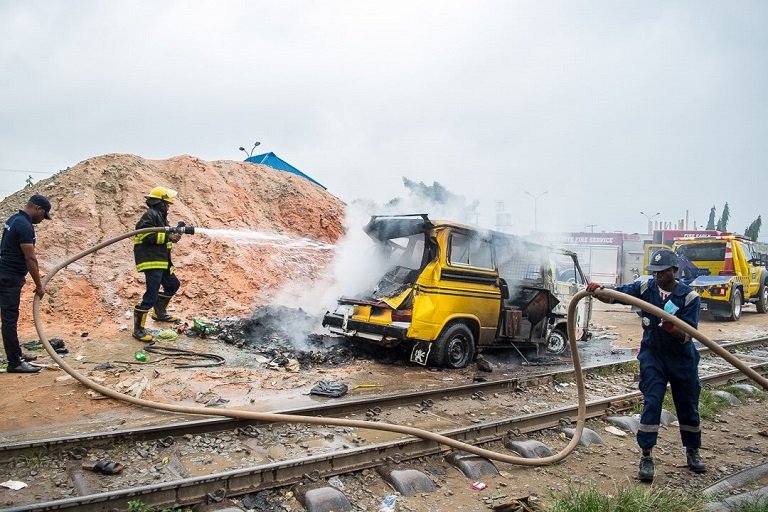 LASEMA officials tried to salvage the burning commercial bus