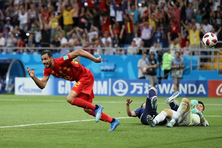 Nacer Chadli wheels away after scoring a late winner for Belgium against Japan