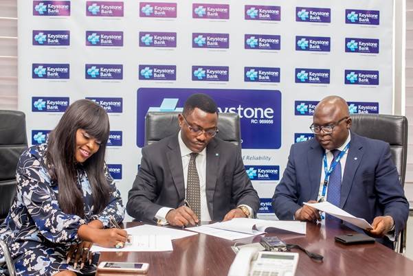 L-R: Mrs. Funke Akindele Bello, Keystone Bank Brand Ambassador, Dr. Obeahon Ohiwerei, GMD/CEO, Keystone Bank Limited, and General Counsel, Keystone Bank Limited, Dr. Michael Agamah during the contract signing of Funke Akindele Bello as Keystone Bank Brand Ambassador, at Keystone Bank Head Office in Lagos recently
