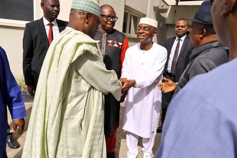 Atiku Abubakar shaking hands with Bishop David Oyedepo