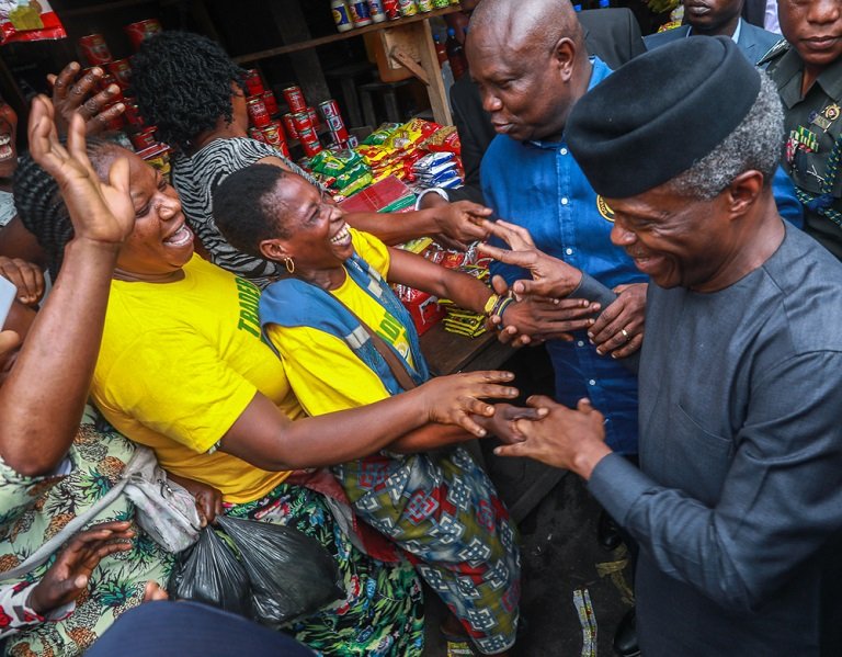 FILE PHOTO: Vice President Yemi Osinbajo during an on-site assessment of Tradermoni