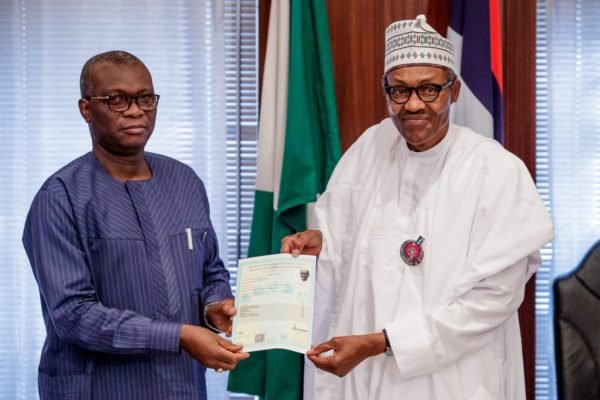 Dr Iyi Uwadiae, WAEC registrar presents President Muhammadu Buhari’s West African Examination Council school certificate