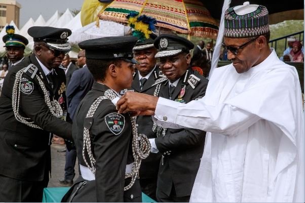 President Muhammadu Buhari commissions a cadet in Kano, Northern Nigeria