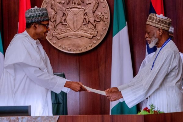 Founding chairman of PDM, Dr Farouk Abdulaziz hands President Muhammadu Buhari PDM's endorsement letter