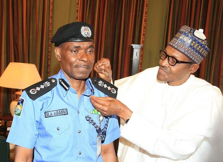 President Buhari decorates Mohammed Adamu as acting Inspector General of Police