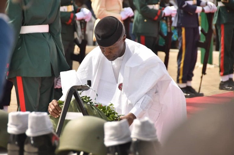Vice President Yemi Osinbajo laying a wreath
