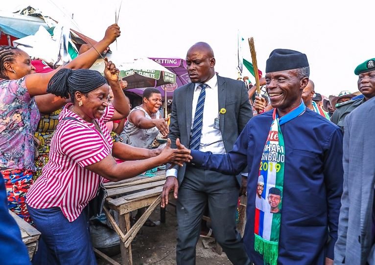 Vice President Yemi Osinbajo walking through a market in Akwa Ibom on Friday