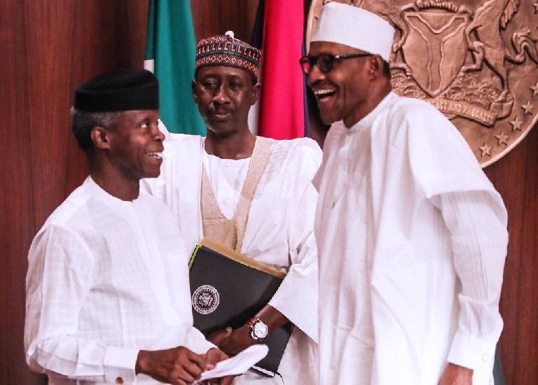 President Muhammadu Buhari shares a joke with Vice President Yemi Osinbajo during a special FEC meeting