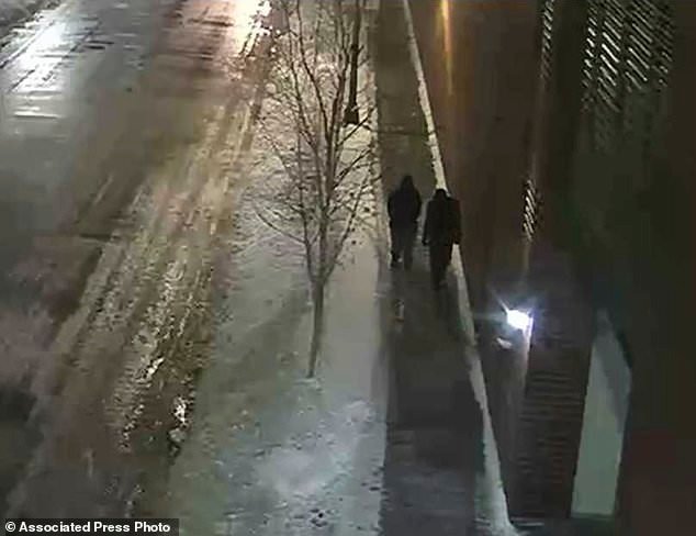 This image provided by the Chicago Police Department and taken from surveillance video shows the Osundairo brothers walking along a street in the Streeterville neighborhood of Chicago