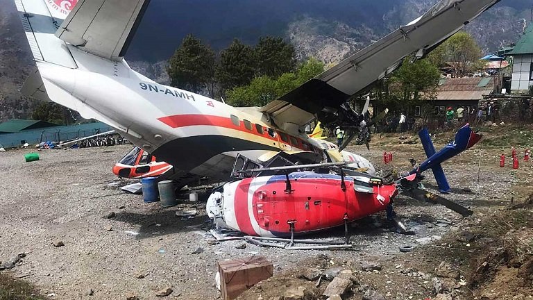 Helicopter: A Summit Air Let L-410 Turbolet aircraft bound for Kathmandu is seen after it hit two helicopters during take off at Lukla airport, the main gateway to the Everest region