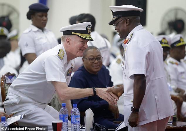 Admiral Ibok-Ete Ekwe Ibas, right,Nigeria Chief of Naval Staff, shakes hands with Adm. James G. Foggo III, U.S. Naval Forces Europe-Africa and commander, Allied Joint Force Command Naples, during the closing ceremony of exercise Obangame in Lagos, Nigeria