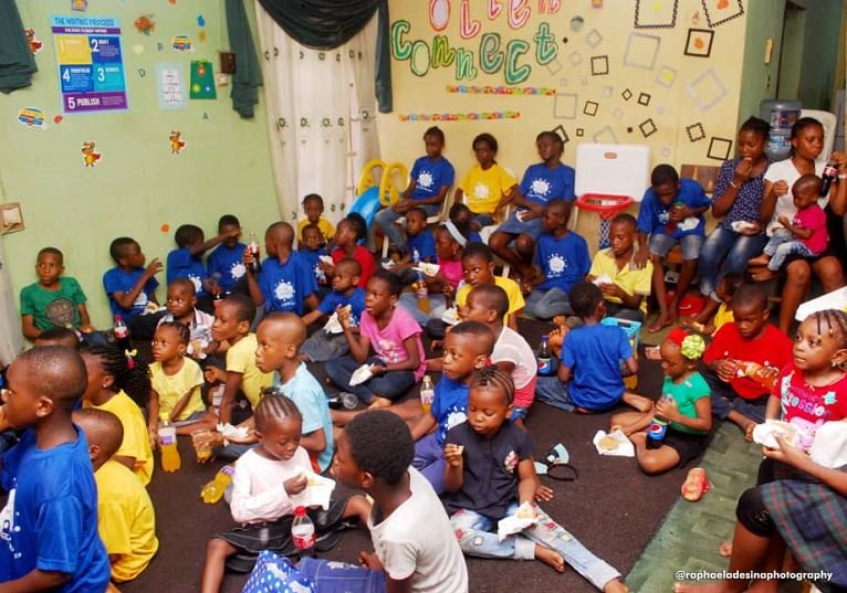 A cross section of pupils learning how to make hand wash soap