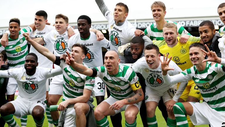 The Celtic team celebrate winning the Scottish Premiership title
