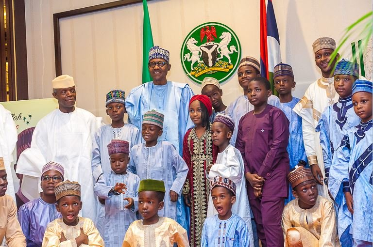 President Muhammadu Buhari and Vice President, Yemi Osinbajo with children who came to pay Eid-El-Fitr Homage at the State House
