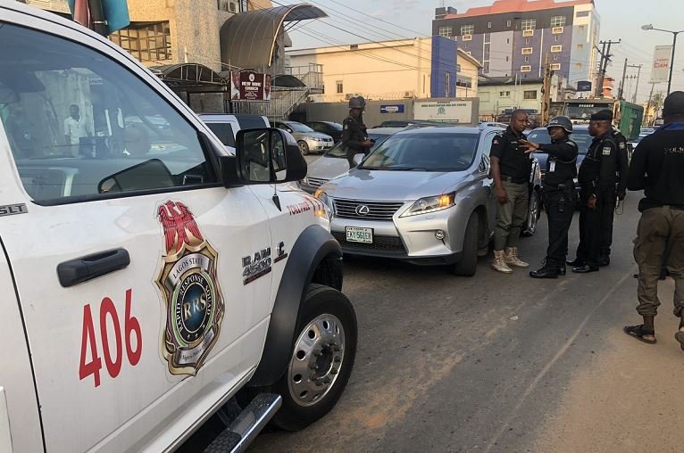 Rapid Response Squad operatives stop a vehicle for driving against traffic