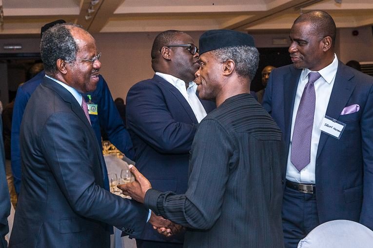 Vice President Yemi Osinbajo interacting with investor Adebayo Ogunlesi
