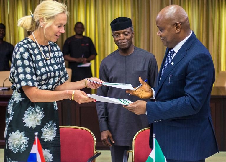 VP Osinbajo witnessing the signing of a communique on the bilateral consultations between Nigeria and Netherlands. (L-R) Netherlands Trade Minister, H.E. Mrs. Sigrid Kaag and Permanent Secretary, Ministry of Industry, Trade and Investment, Sunday Akpan