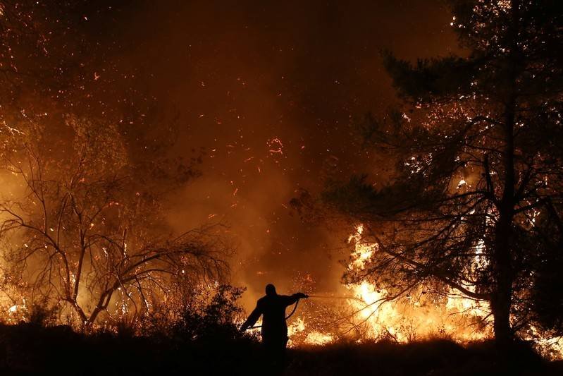 Wildfire burns in Greek