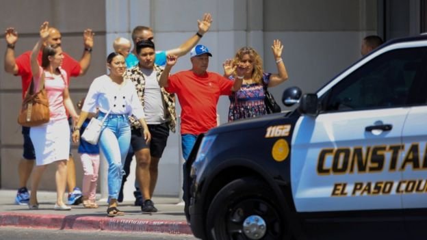 Shocked shoppers were ushered out of the area with their hands raised