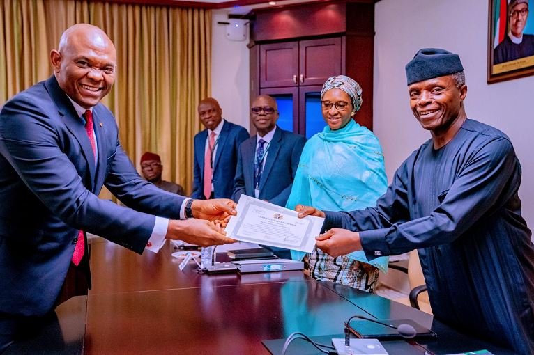 Tony Elumelu receives Transcorp Hotel's Certificate of Discharge from Vice President Yemi Osinbajo