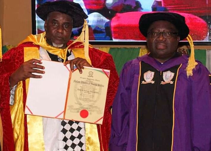 Alhaji Abdulmunaf Yunusa Sarina, President and Chief Executive Officer of Azman Group, and Professor Gregory Iyke Ibe, Chancellor and Founder of Gregory University, at the conferement of doctorate degree on Sarina at the university in Uturu, Abia State