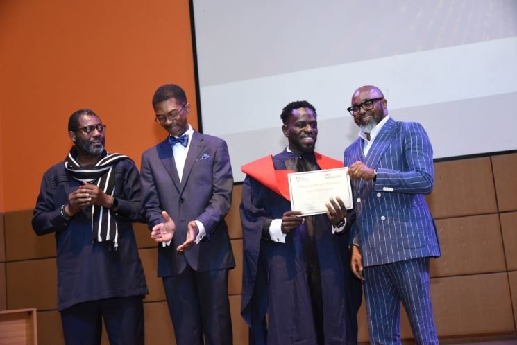 Edmund Asamoah presented his certificate by MultiChoice Nigeria MD, John Ugbe