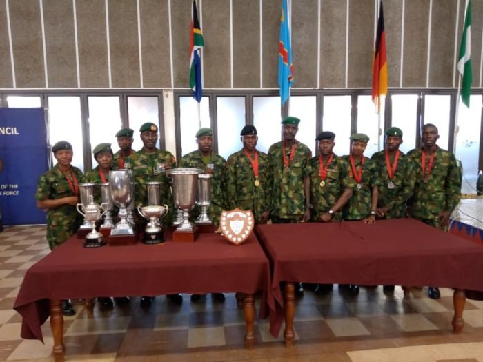 Nigerian Armed Forces pose with their medals and trophies